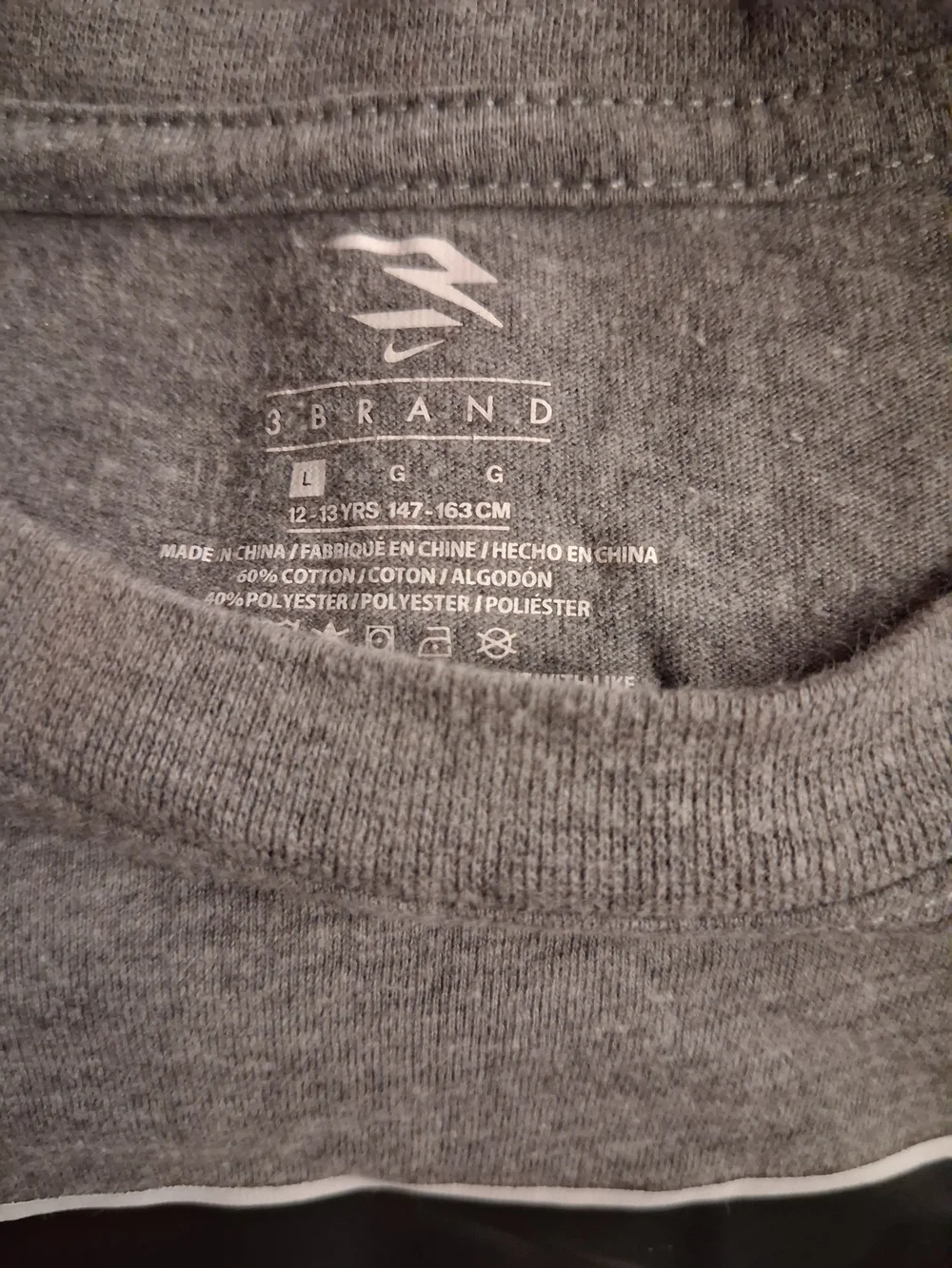 Nike Gray Kids Short Sleeve Tee with Stylized Logo